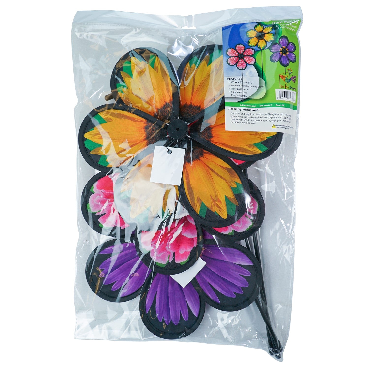 Assorted 10-inch realistic flower spinners showcasing Aster, Sunflower, and Peony designs, gently spinning in an outdoor garden setting.
