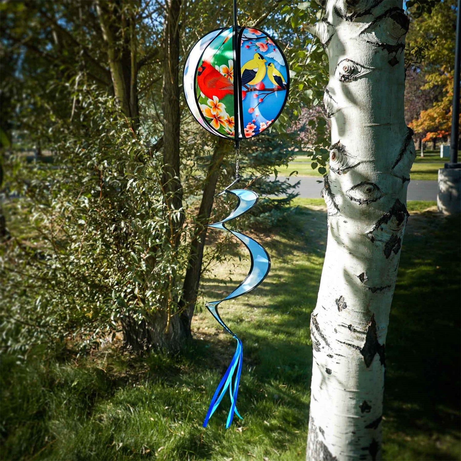 Colorful 11" Bird Hanging Ball Spinner featuring printed bird designs and bright tail, perfect for adding playful motion to your outdoor decor.