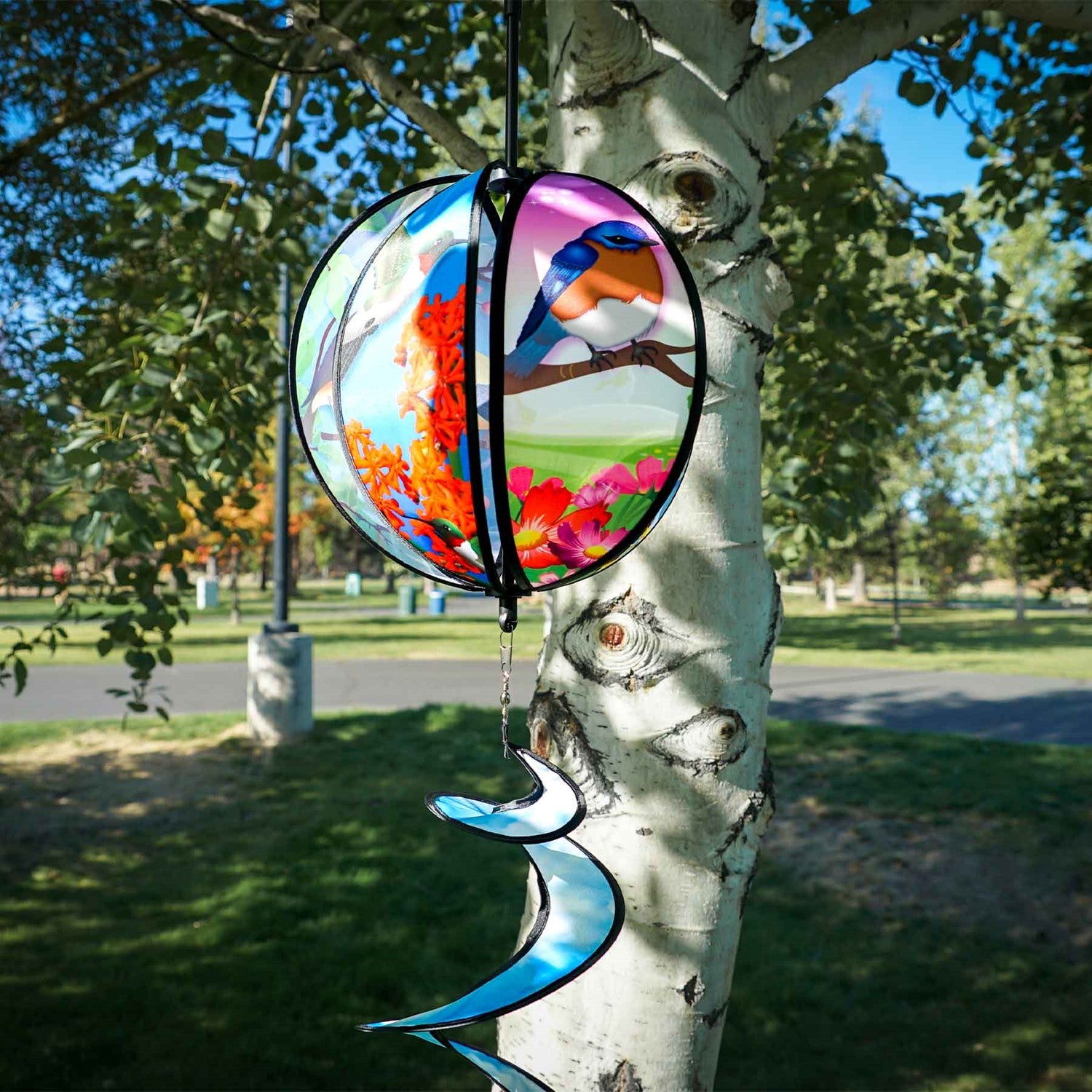 Colorful 11" Bird Hanging Ball Spinner featuring printed bird designs and bright tail, perfect for adding playful motion to your outdoor decor.