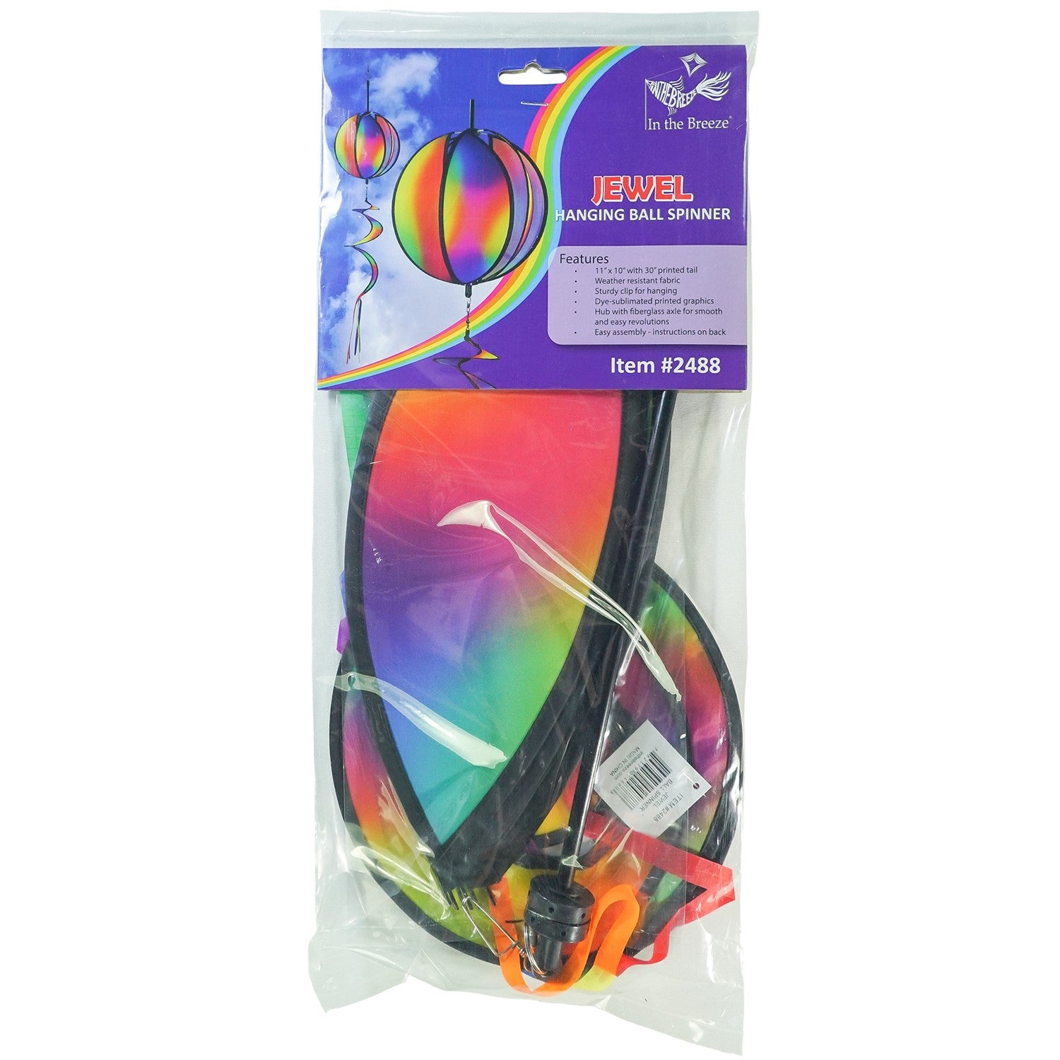 11-inch Jewel Hanging Ball Spinner with blended jewel design spinning in a garden, featuring six colorful panels and a 30-inch curlie tail.
