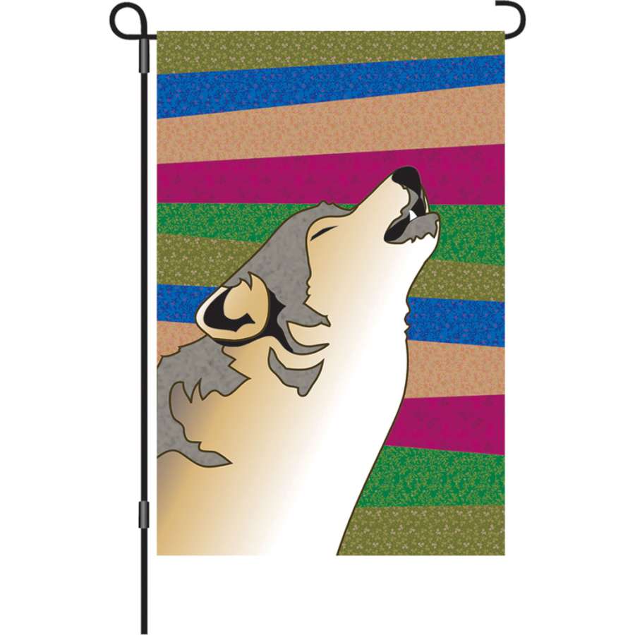 12 in. Durango Night flag displaying dark blue and green hues, fluttering gently in a garden setting during twilight hours.