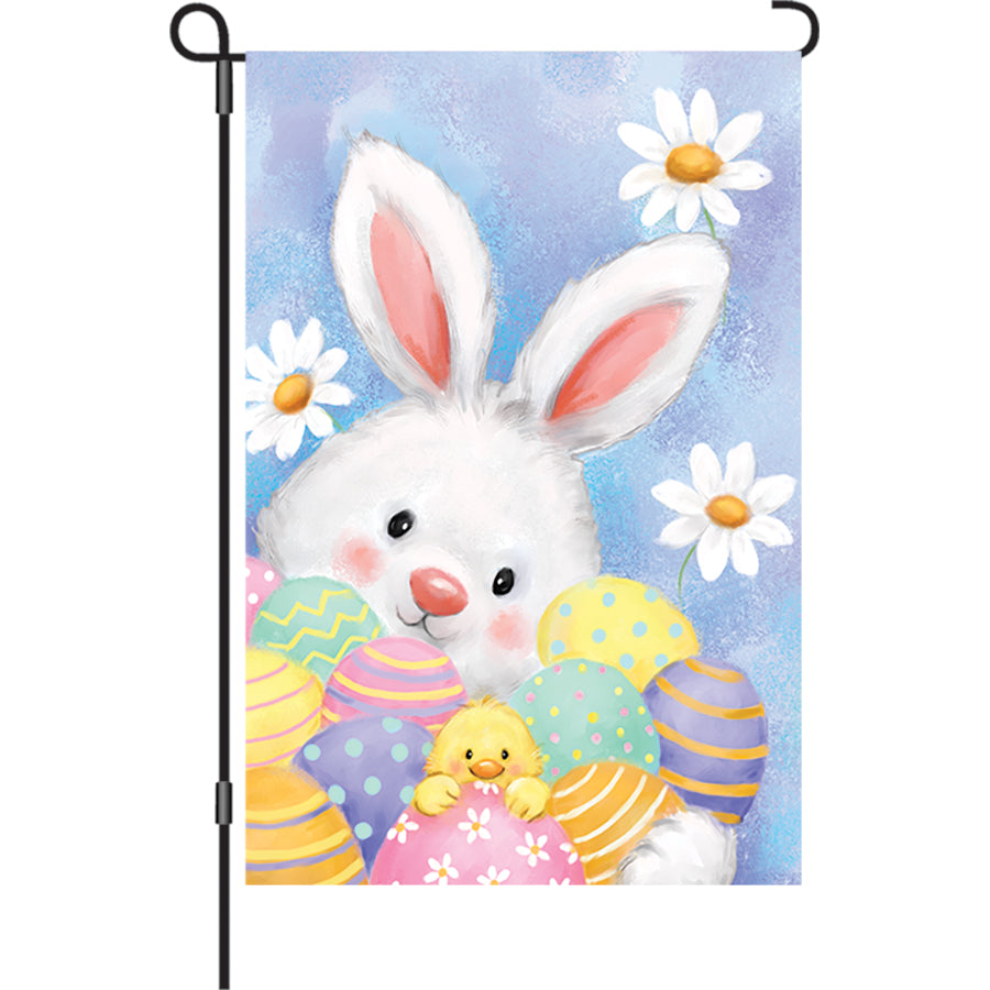 12 in. Easter Friends garden flag featuring colorful characters displayed outdoors welcoming spring festivities.