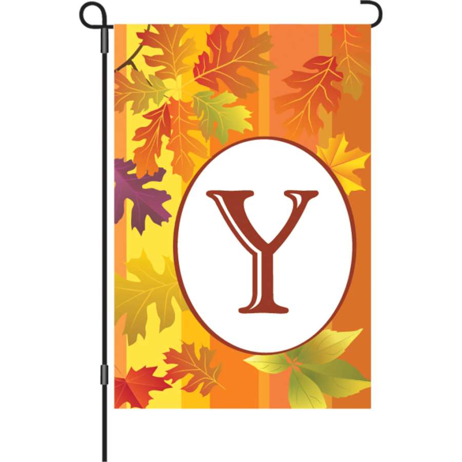 12 in. Fall Monogram Flag - Y displaying vibrant seasonal colors and a prominent letter 'Y' in a garden setting, enhancing outdoor decor.
