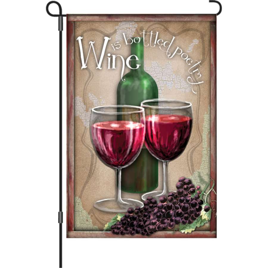 12 in. Flag - Bottled Poetry displayed in a garden, featuring a soft fabric with a whimsical wine-themed design and text that reads 'Wine is bottled poetry.'