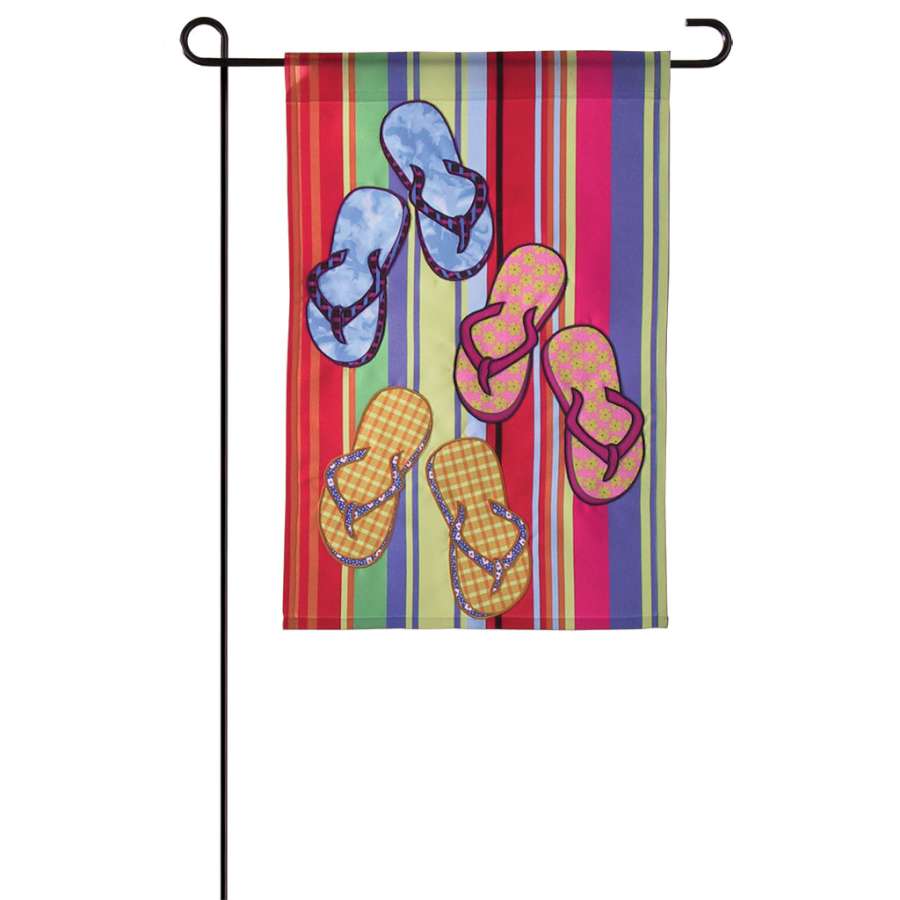 12 in. Flag - Espadrille Flip Flops featuring vibrant flag designs displayed on a beach setting, showcasing unique summer style.