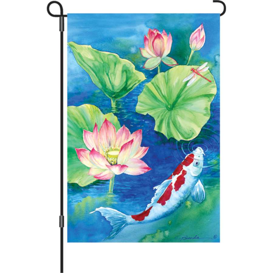 Illuminated 12 in. Lotus Koi flag displayed in a garden setting, showcasing vibrant colors and intricate koi fish designs.