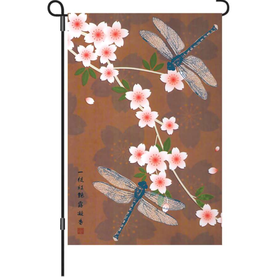 A 12 in. fragrant garden flag featuring colorful floral designs, displayed outdoors on a garden flag stand amid blooming plants.