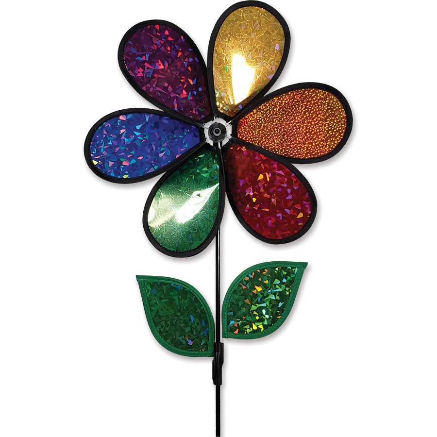 12 in. Flower Spinner with rainbow holographic petals dancing in the wind in a colorful garden setting.