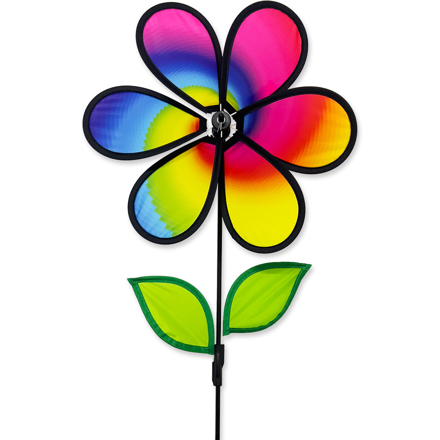 12 in. Flower Spinner - Rainbow Spiral featuring colorful petals spinning in the breeze displayed in a garden setting.