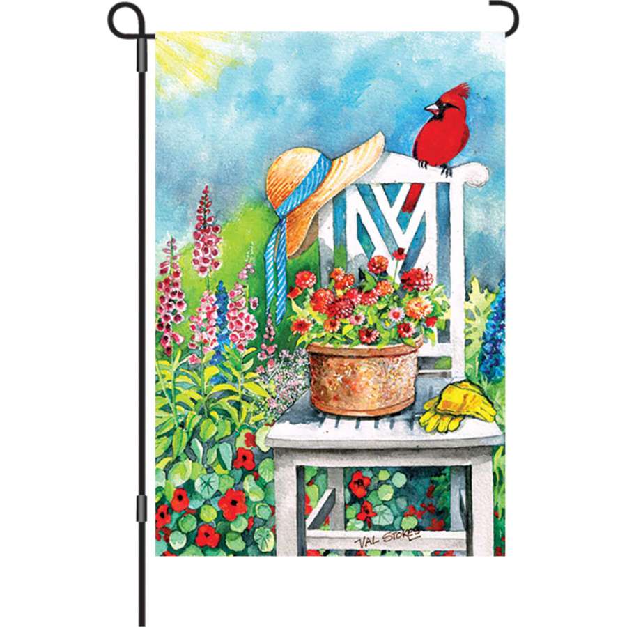 12 in. Gardener's Patch illuminated flag featuring vibrant gardening designs displayed in a sunny outdoor garden setting.