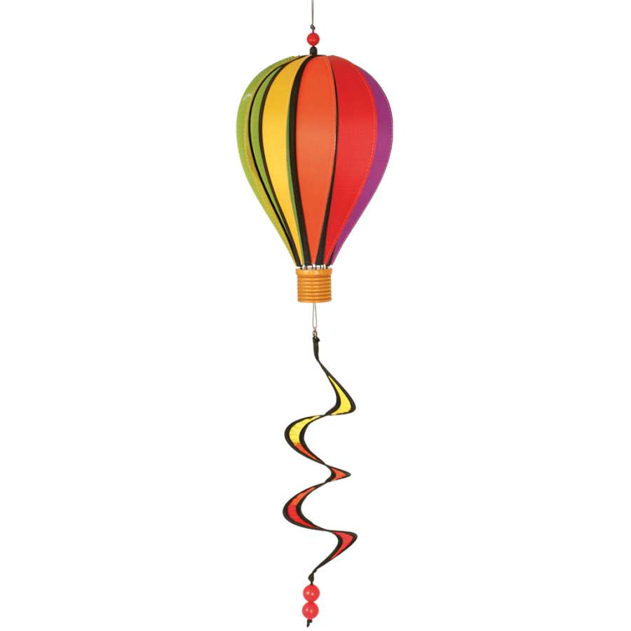 12 in. Hot Air Balloon - Rainbow, a colorful spinning decoration in a garden setting, showcasing its vibrant design and movement.