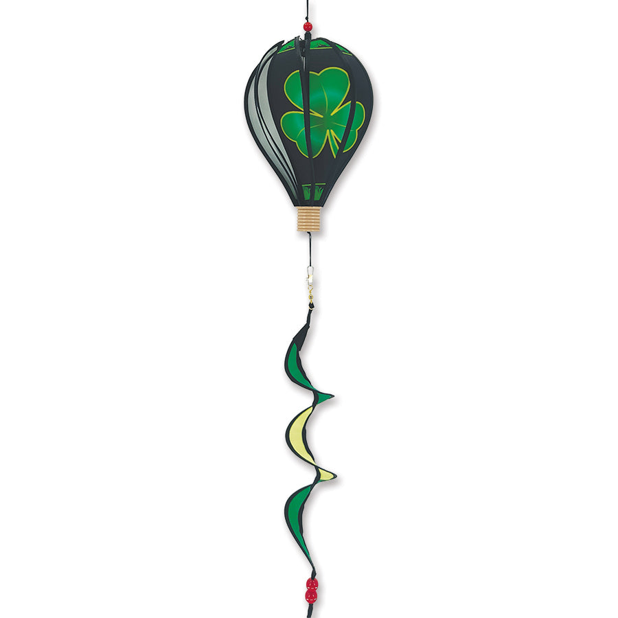 12 in. Hot Air Balloon featuring a colorful shamrock design, spinning gently in a garden setting, bringing festive charm to outdoor decor.