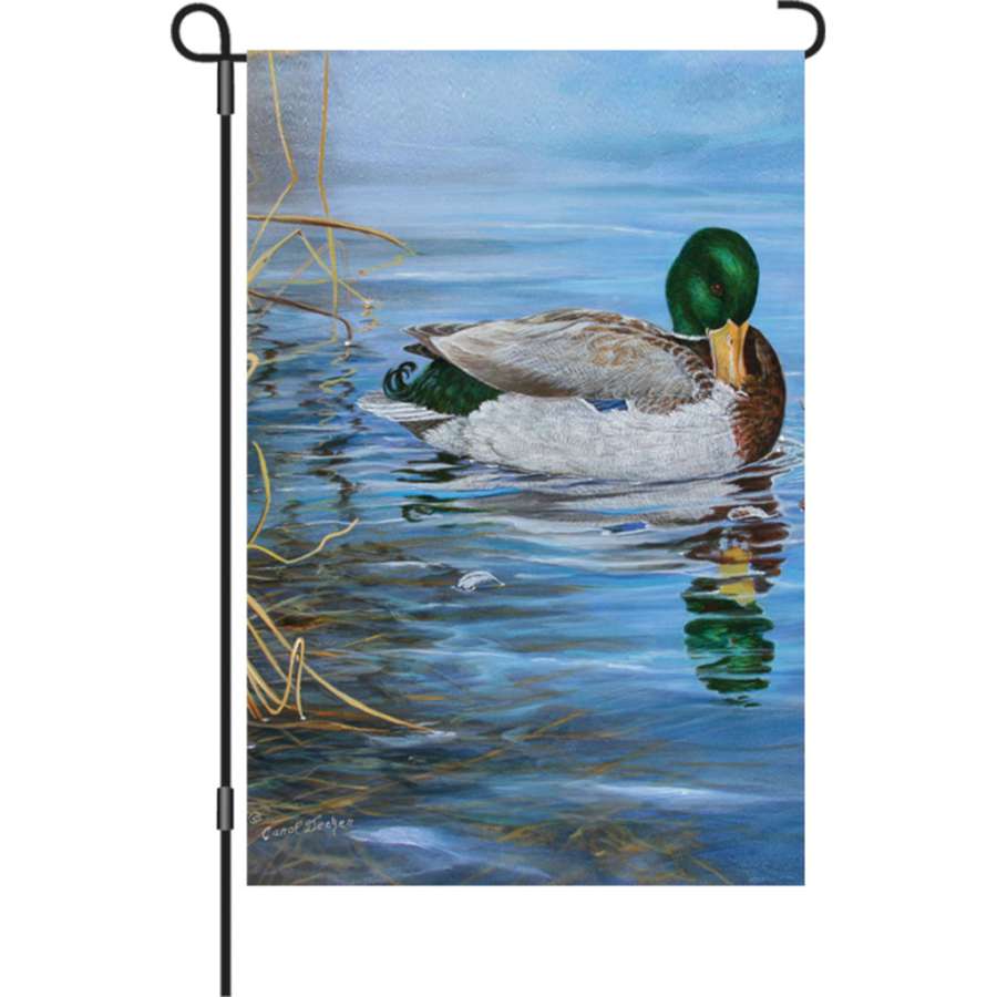 12 in. illuminated garden flag featuring a vibrant mallard duck design displayed in a garden setting during the evening.