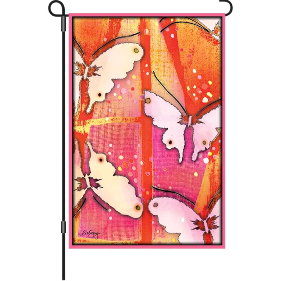 12 in. illuminated Mariposa Flag featuring colorful butterfly designs displayed in a garden setting, showcasing its vibrant colors.