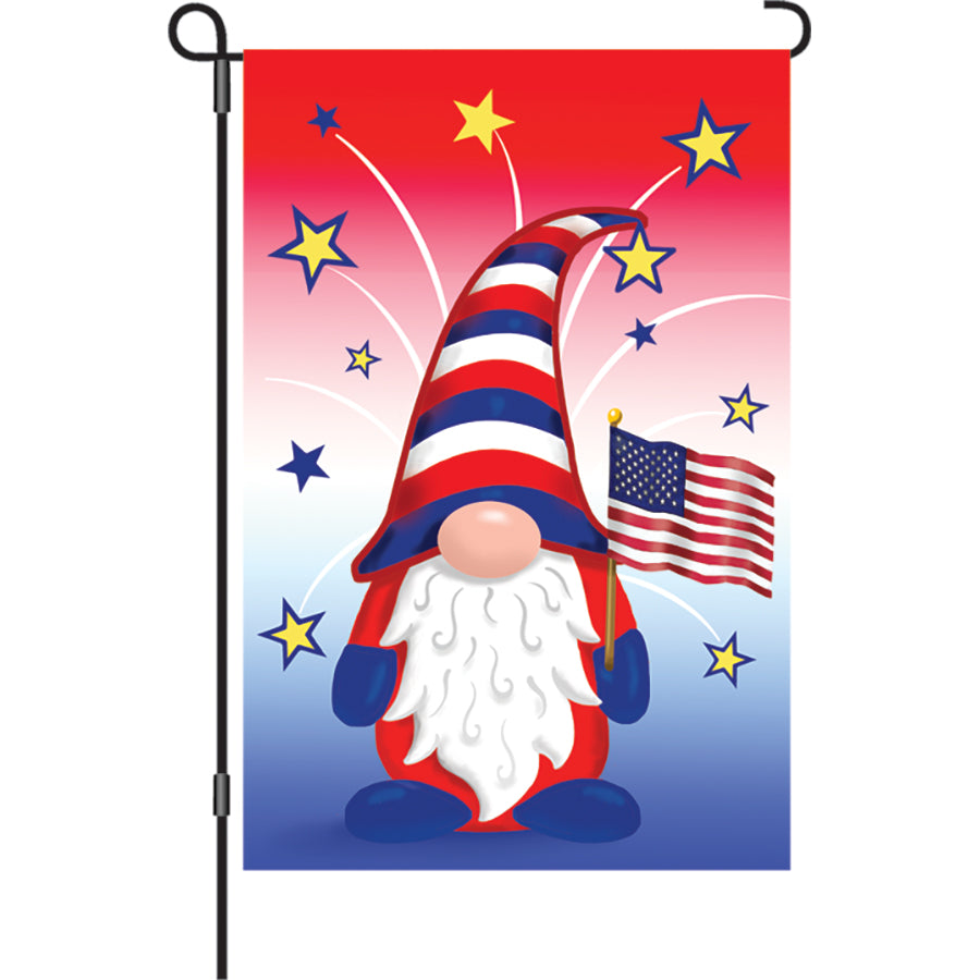 12 in. illuminated Patriotic Gnome garden flag with vibrant colors and design, displayed on a flagpole in a sunny garden.