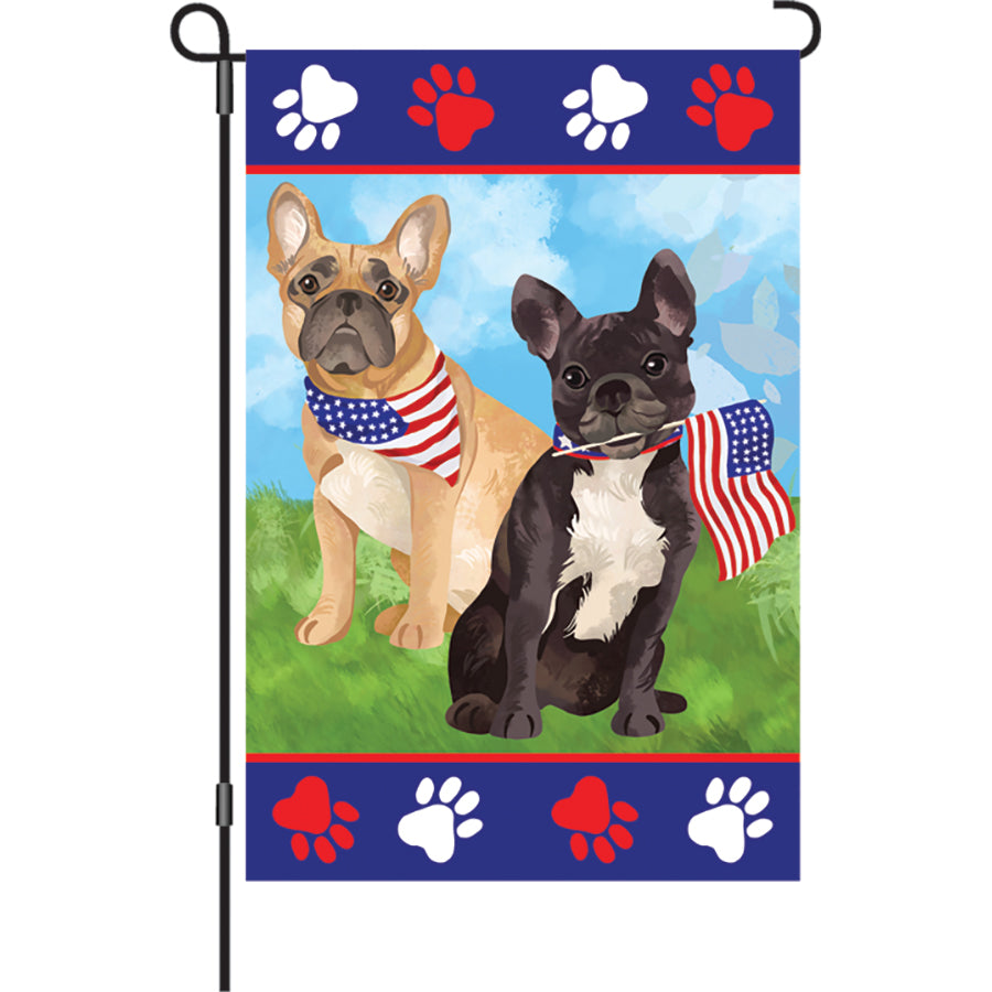 12 in. Patriotic Pups garden flag featuring adorable puppies and American symbols, displayed in a garden setting with vibrant colors.