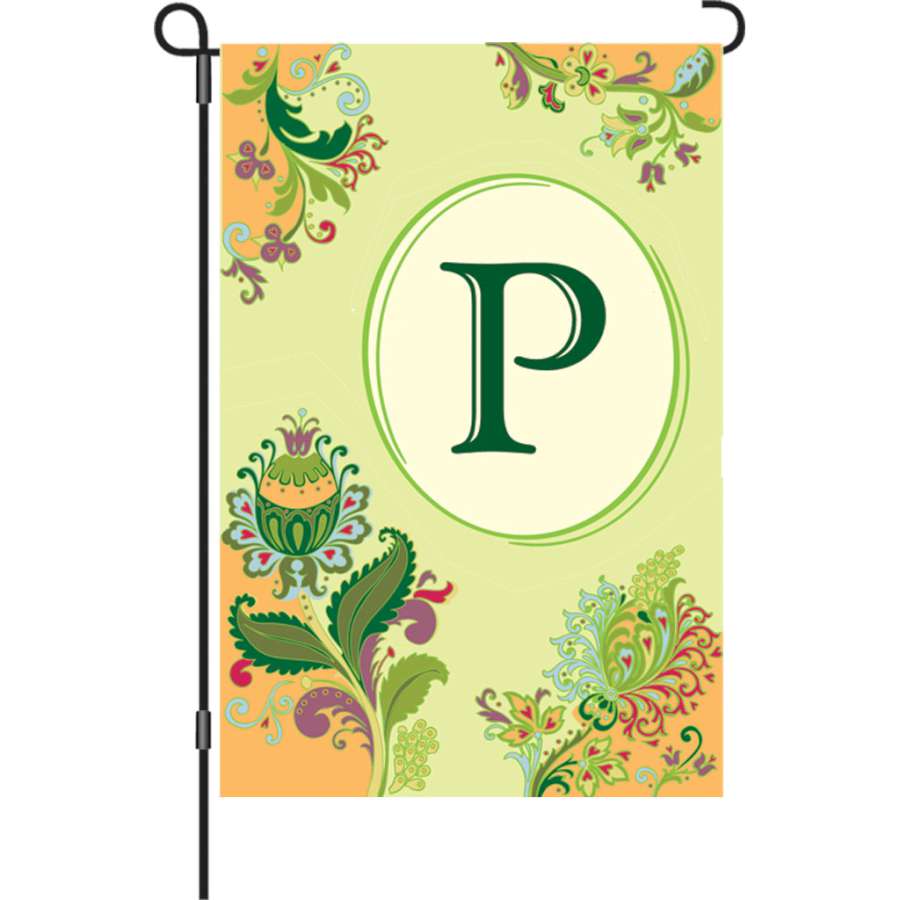 12 in. Spring Monogram Flag with the letter P displayed in a colorful garden setting, adding vibrant decor to the outdoor space.