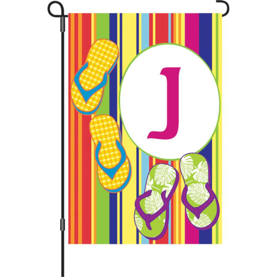 12 in. Summer Monogram Flag with letter 'J' displayed in a garden setting, showcasing vibrant colors against a bright summer backdrop.