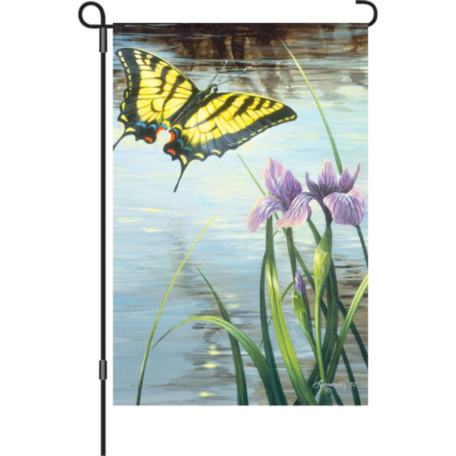 12 in. illuminated garden flag featuring swallowtail butterflies and irises, displaying vibrant colors and intricate design in an outdoor setting.