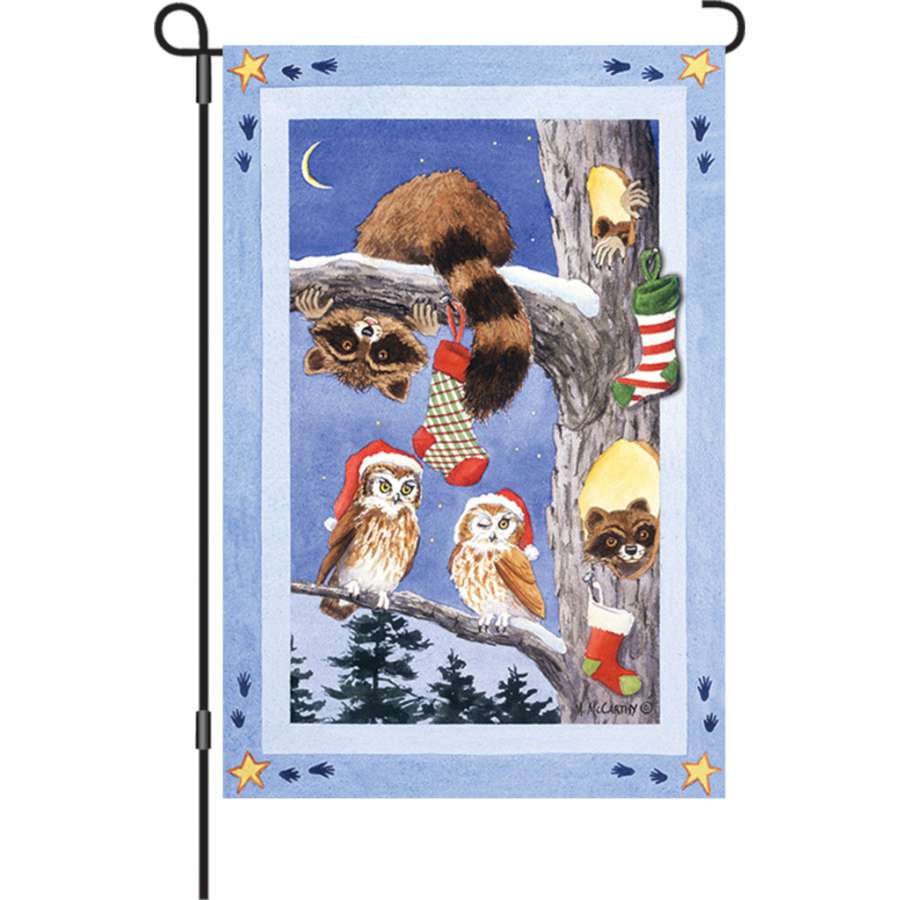 12 in. Woodland Stocking Flag with vibrant woodland theme displayed in a garden setting, capturing the festive holiday spirit.