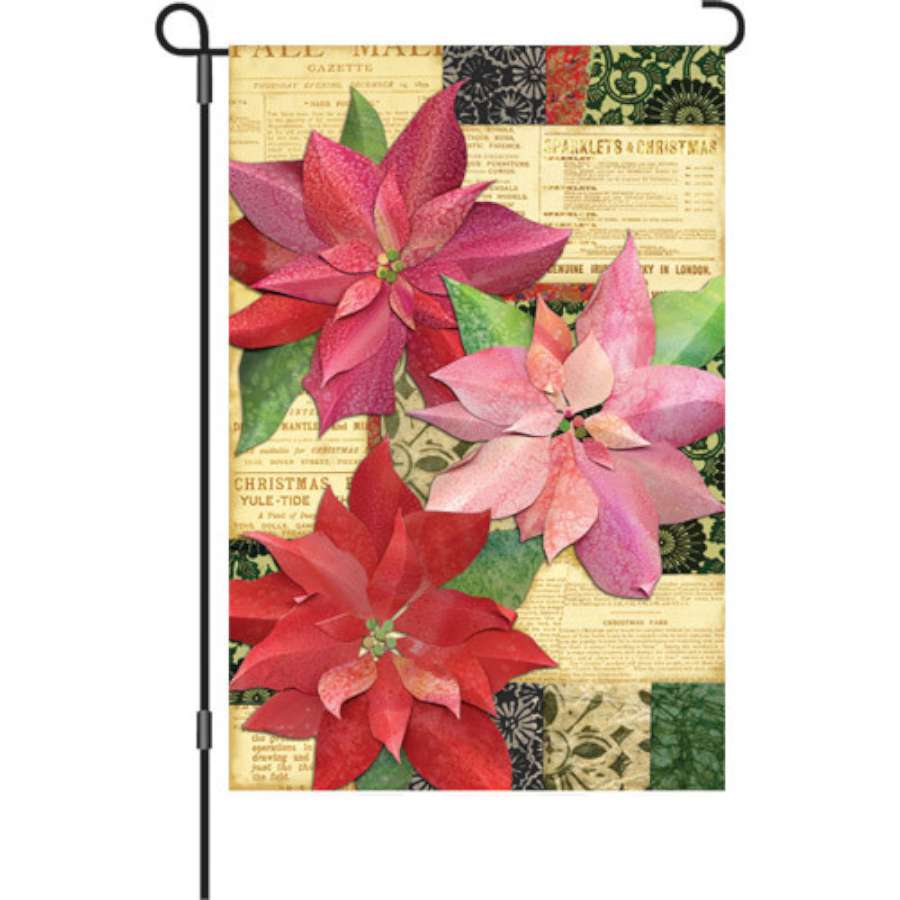 Illuminated 12 in. Yuletide Poinsettia garden flag with vibrant flowers displayed outdoors, adding festive cheer to winter decorations.