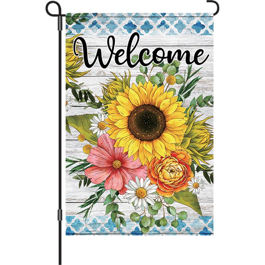 12 in. Flag - Welcome Flowers featuring colorful floral design and the word 'Welcome' displayed in an outdoor garden environment.