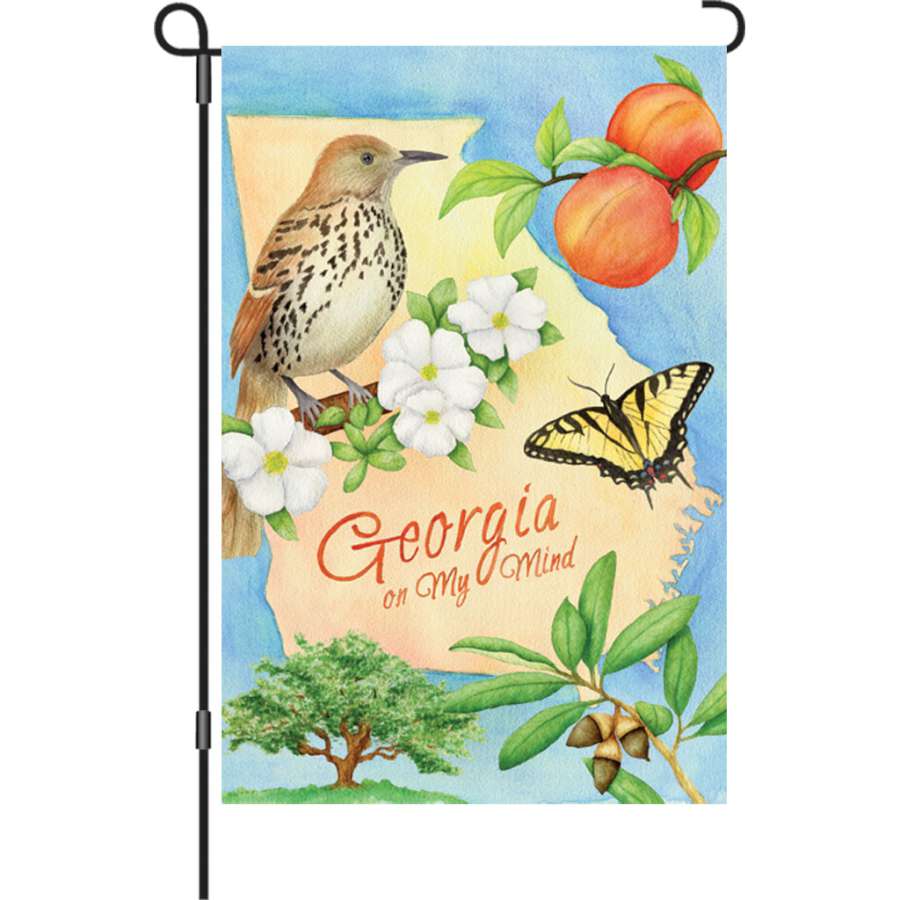 12-inch Georgia illuminated garden flag made from durable polyester fabric, displayed on a garden flag stand in a lush yard setting.