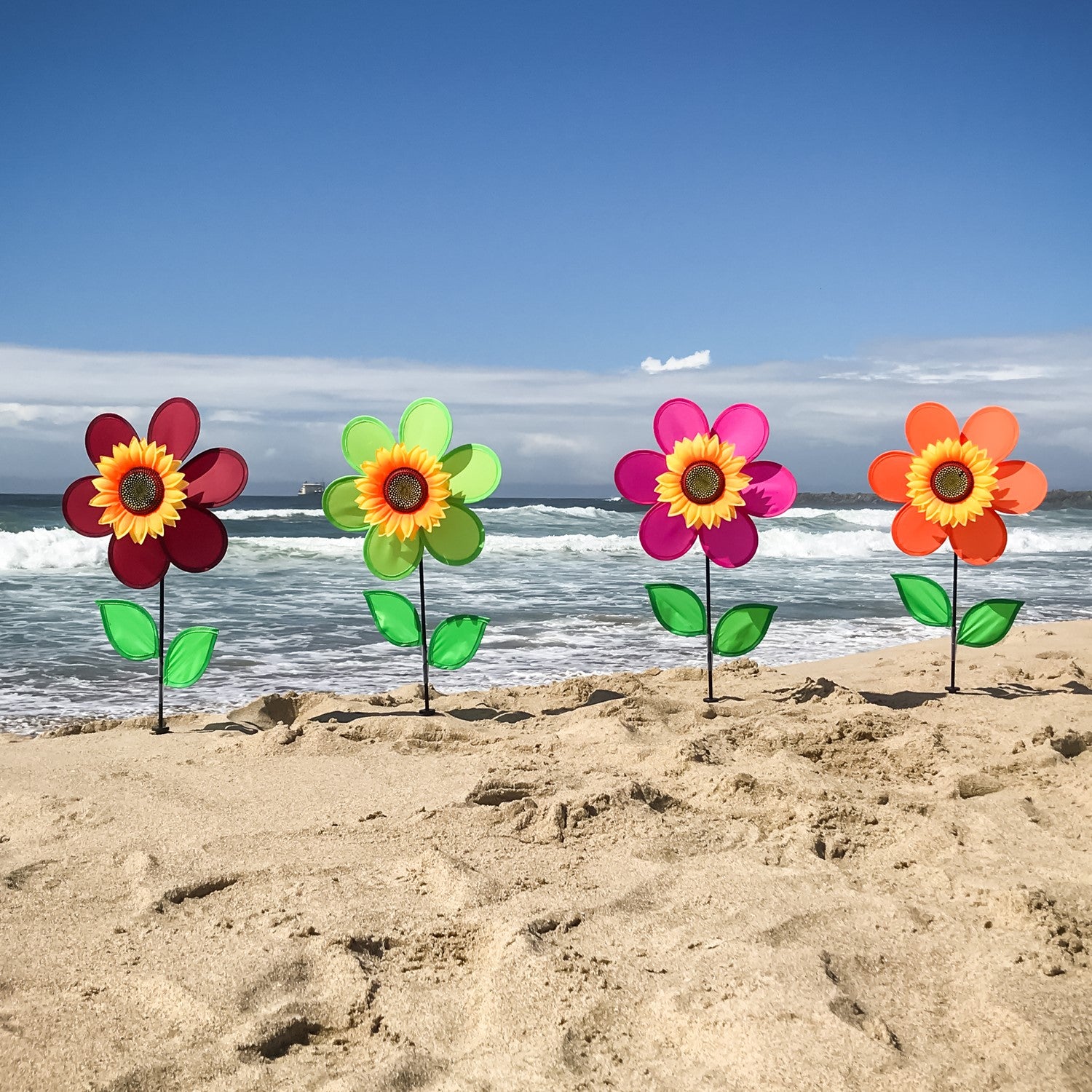 12-Inch Green Sunflower Spinner with vibrant green petals and detailed sunflower center, elegantly displayed in a garden setting.