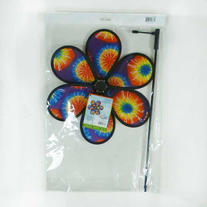 12-inch Tie Dye Flower garden spinner with colorful petals spinning in the breeze on a fiberglass pole, enhancing garden decor's vibrancy.