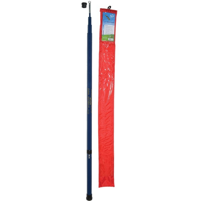 A 13' heavy duty telescoping flag pole made of reinforced fiberglass, extended to display a colorful flag outdoors in a garden setting.