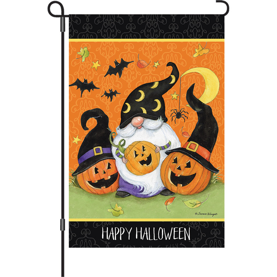 13 in. Elite Oversized Garden Flag featuring a whimsical gnome surrounded by bats, displayed on a garden flag pole in an autumn setting.