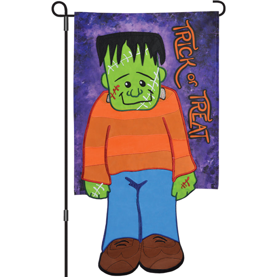 13 in. Enhanced Flag - Little Frankie garden flag featuring colorful embroidered applique design with 'TRICK or TREAT' text displayed in a garden setting.