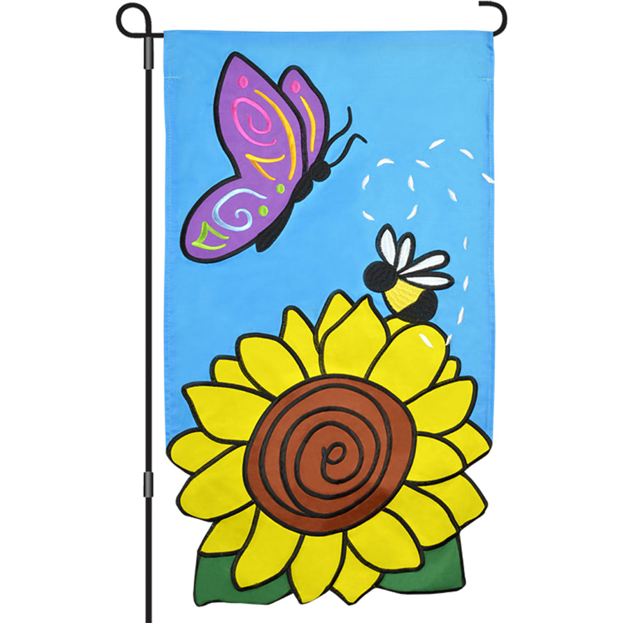 13 in. Enhanced Flag - Sunflower Friends with vibrant sunflower embroidery displayed on a garden flag pole, brightening an outdoor area.
