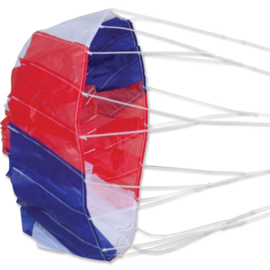 14 in. Dynamo kite, 14 inches in diameter, showcasing a vibrant patriotic design while spinning in the air at a summer picnic.