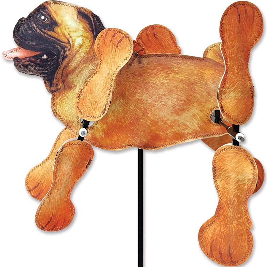 15 in. WhirliGig Spinner with a Tan Pug design spinning in the breeze, creating a joyful atmosphere in a colorful garden setting.