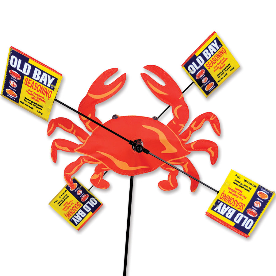 16 in. WhirliGig Spinner featuring a colorful crab and mallets design representing Old Bay seasoning, spinning in an outdoor garden setting.