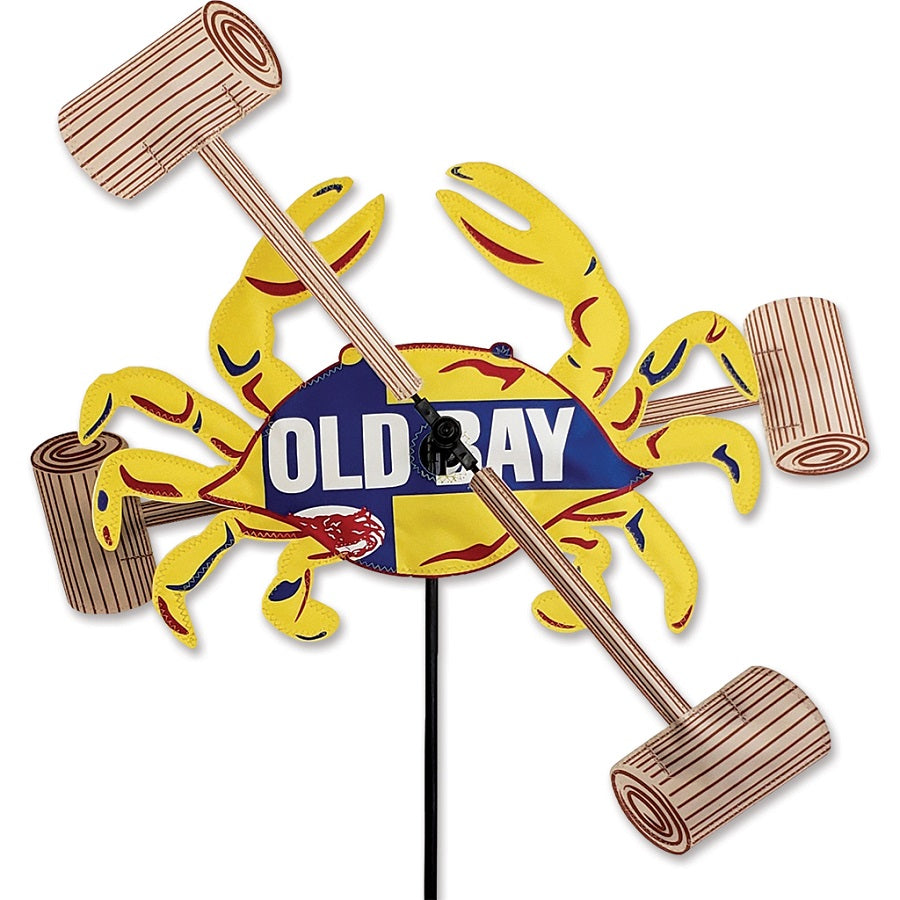 16 in. WhirliGig Spinner featuring a colorful Old Bay crab design, spinning in a yard captured in bright, sunny weather.