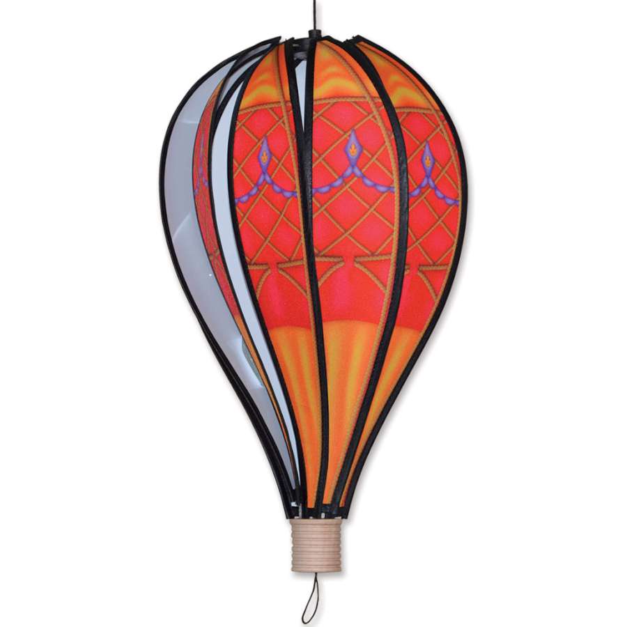 18 in. Red Vintage Hot Air Balloon gracefully spinning in the breeze, showcasing vibrant colors and intricate detailing against a garden backdrop.