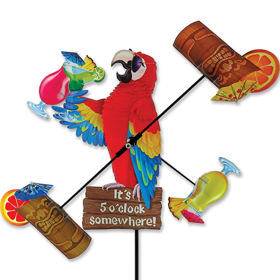 18 in. WhirliGig Spinner - Island Parrot featuring colorful fabric design spinning in the breeze in a garden setting.