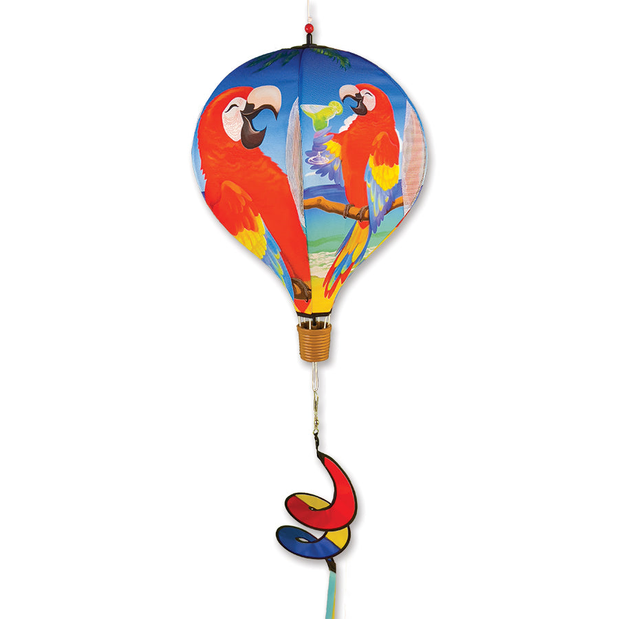 Colorful 19 in. Pop-Open Hot Air Balloon with '5 O'Clock Somewhere' design spinning in the wind, showcased on a porch railing.