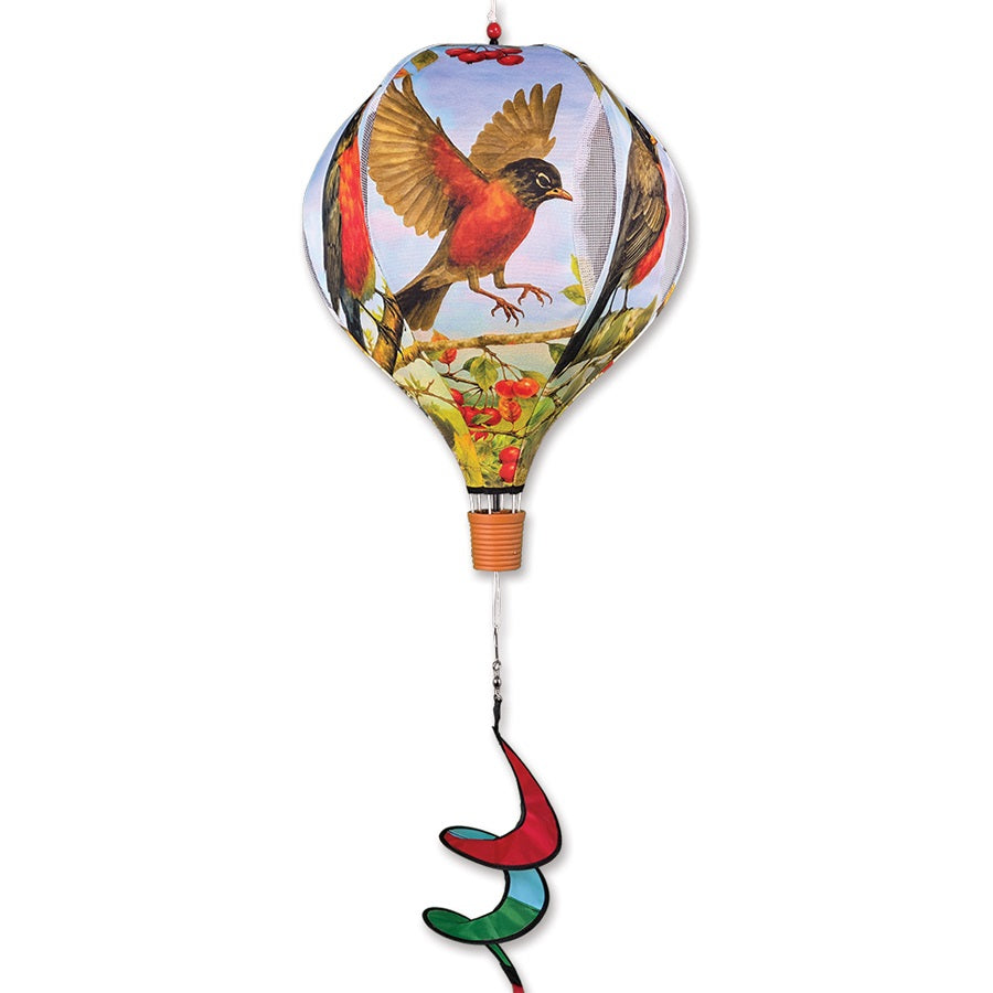 19 in. Pop-Open Hot Air Balloon featuring an American Robin design, spinning gracefully in a garden setting on a sunny day.