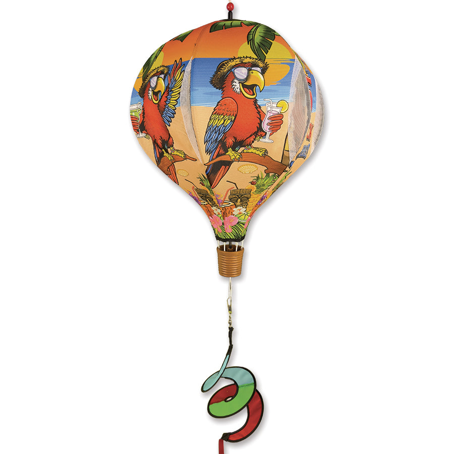 19 in. Pop-Open Hot Air Balloon spinning in vibrant colors against a blue sky, beautifully displayed in a garden setting.