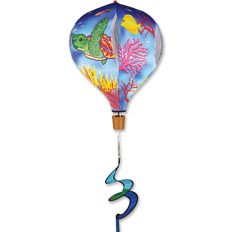 19 in. Pop-Open Hot Air Balloon featuring a sea turtle design, spinning in the breeze on a deck, showcasing vibrant outdoor decor.