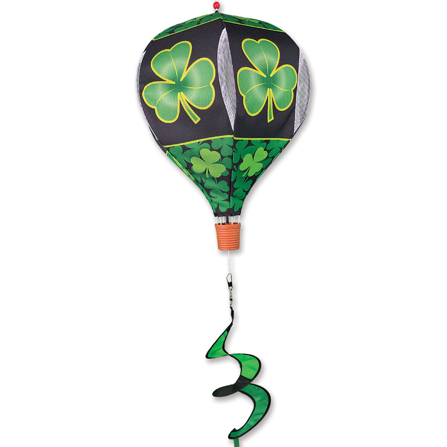 19 in. Pop-Open Hot Air Balloon featuring a shamrock design, displayed outdoors, spinning gracefully in the wind against a clear sky.