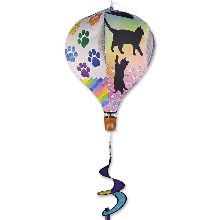 19 in. Pop-Open Hot Air Balloon spinning in the wind, showcasing bright colors and design on an outdoor deck.
