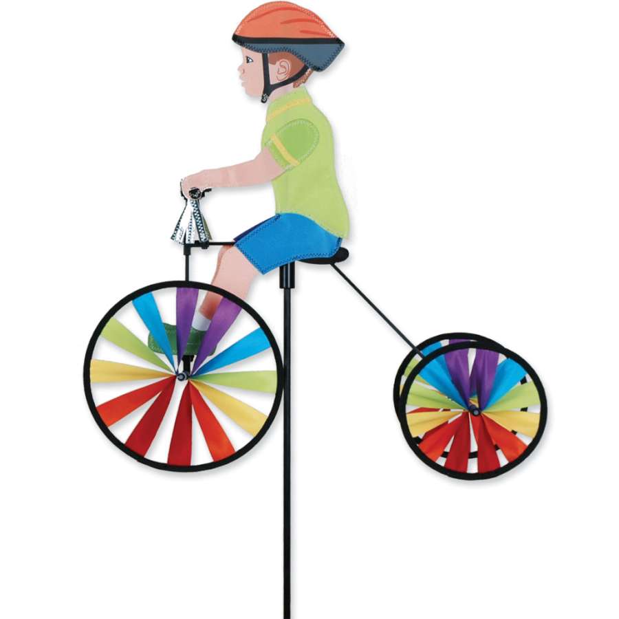 Brightly colored 19 in. Tricycle Spinner with shiny silver tassels on handlebars, designed for toddlers, showcased outdoors on a sunny day.