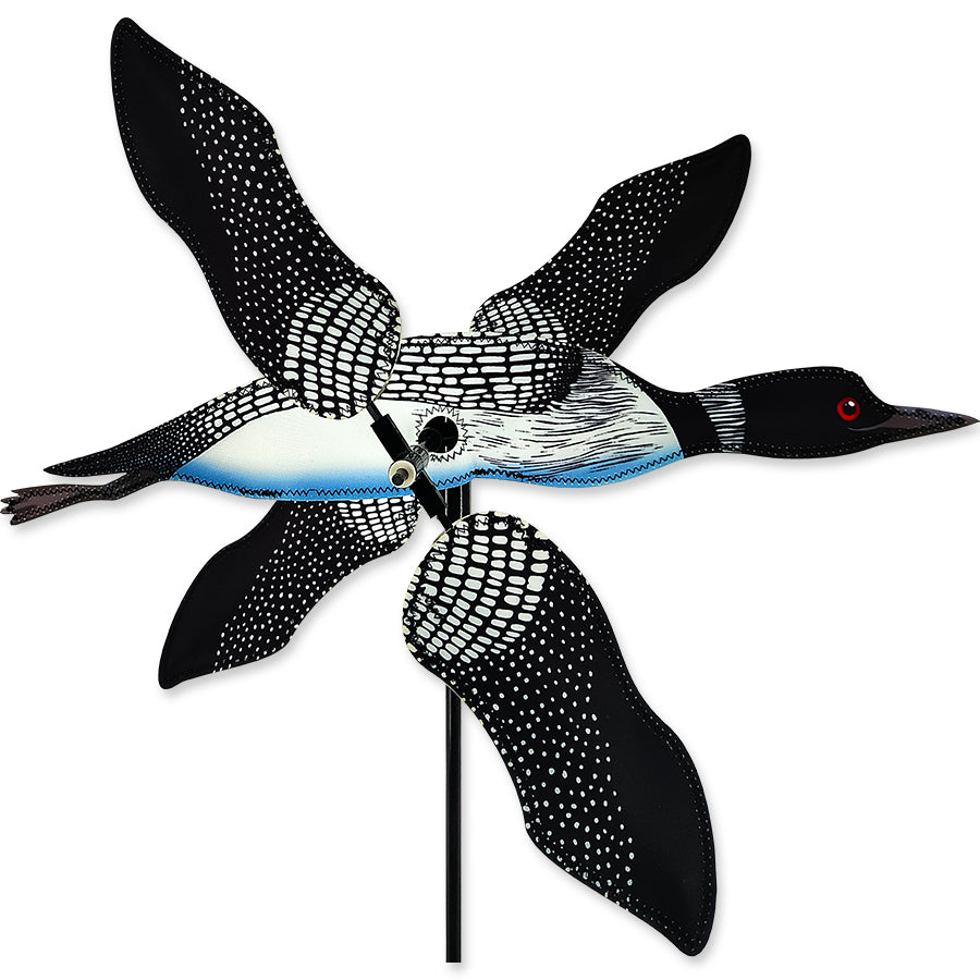 19 in. WhirliGig Spinner featuring a colorful loon design spinning gracefully in a garden setting, demonstrating playful outdoor decor.
