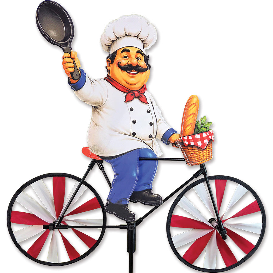 20 in. Bike Spinner - Chef featuring a joyful chef character with lettuce and baguette, spinning elegantly in an outdoor garden setting.