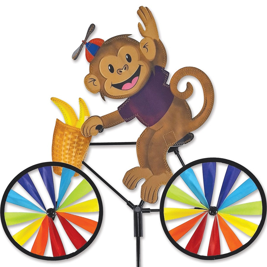 20 in. Bike Spinner featuring a playful monkey design spinning in the breeze, showcasing bright colors on durable fabric in an outdoor setting.