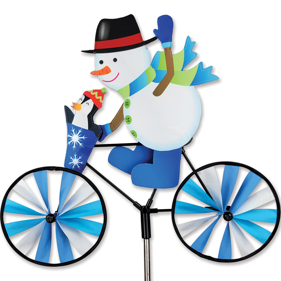 Colorful 20 in. Bike Spinner - Snowman spinning gracefully in the wind, featuring a cheerful snowman design, set against a winter garden backdrop.